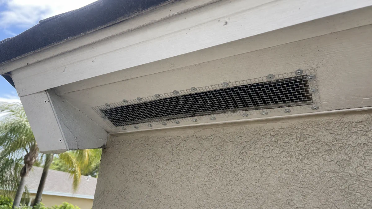 Wildlife exclusion screening fitted beneath an Orlando roofline vent
